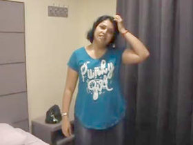 An alluring Indian woman sensually disrobes and performs oral sex