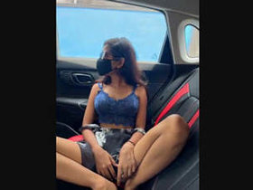 Stunning woman exposes her intimate areas while riding a car