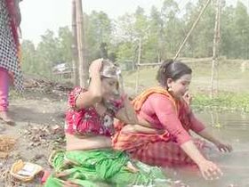 Indian village maiden's bath time