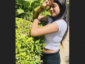 A stunning young woman engages in a passionate encounter