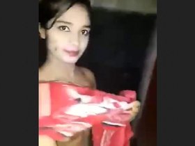 A young girl from a village takes a bath