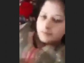 A Pakistani woman with large breasts proudly displays them