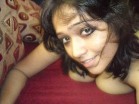 Kiran, an Indian wife, engages in explicit sexual activity with her husband's male companion in a heated video
