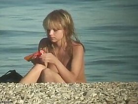 A nudist teenager sunbathing