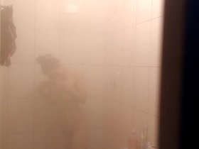 Filming my attractive relative as she enjoys a steamy shower