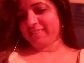 Mature woman flaunts her stunning breasts in sensual video