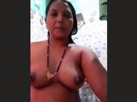 Aroused middle-aged Indian wife takes a bath