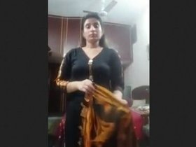 Watch a busty wife strip down in this extended video