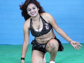 A stunning girl performs a tantalizing dance