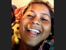 Waafiyah, an Indian woman with large breasts, displays them in a rural setting