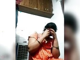 Home show of an amateur model in an orange sari giving a blowjob