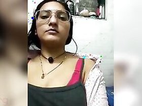 Desi slut in sexy glasses shows off her huge tits for a live webcam show