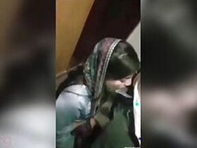 Dressed Desi Indian woman gets down on her knees to suck a meaty XXX sausage