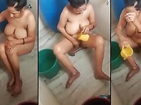 Slutty shower Desi aunt nude bathes in the open air secretly recorded on MMS by her son
