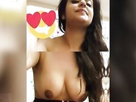 Stunning Desi bhabhi playfully undresses, exposing her lovely XXX breasts