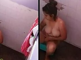 Charming Auntie Desi nude bathing outdoors, secretly recorded on MMS by boyfriend
