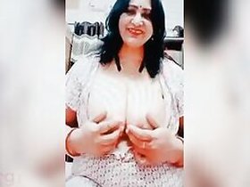 Mature Indian XXX woman shows her super big tits on camera