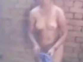 Desi in an outdoor shower, captured by a voyeuristic neighbor