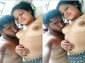 Sexy Desi Bhabhi sucking on Dewar's Breasts